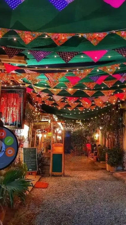 Evening lighting and café culture inside Champa Gali South Delhi