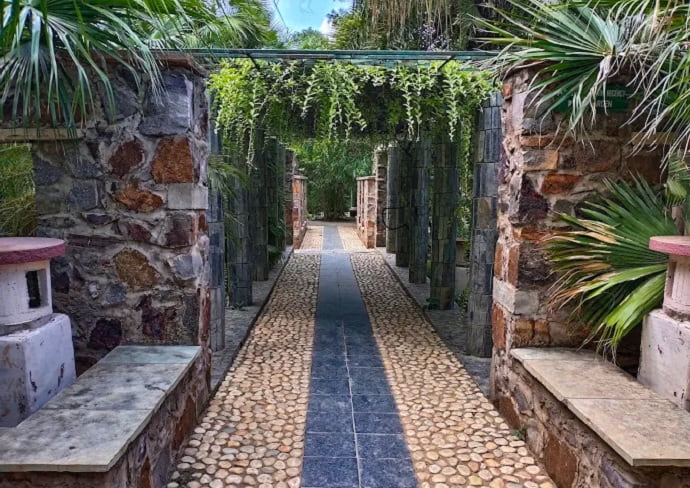 The Garden of Five Senses at the evening view of a Gallery corridor